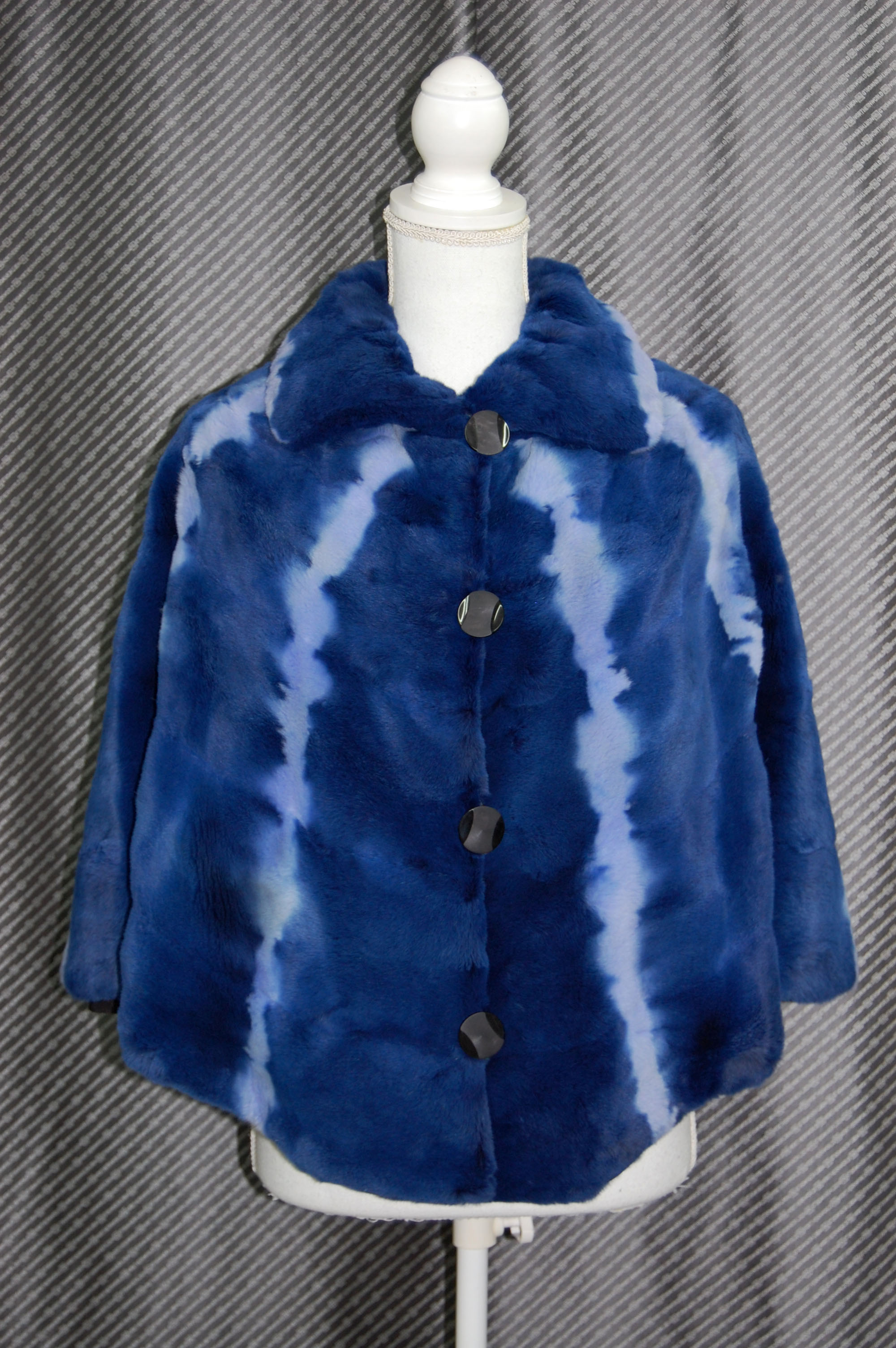 プラックトウィーゼル　リバーシブルケープの画像